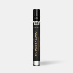 Black travel size perfume atomiser with a black cap and label, standing upright on a plain light grey background.