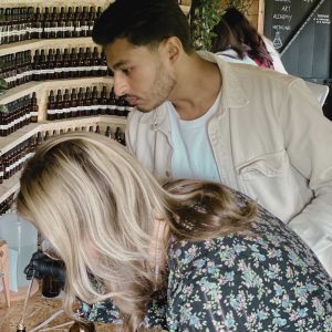 two people at a perfume making class