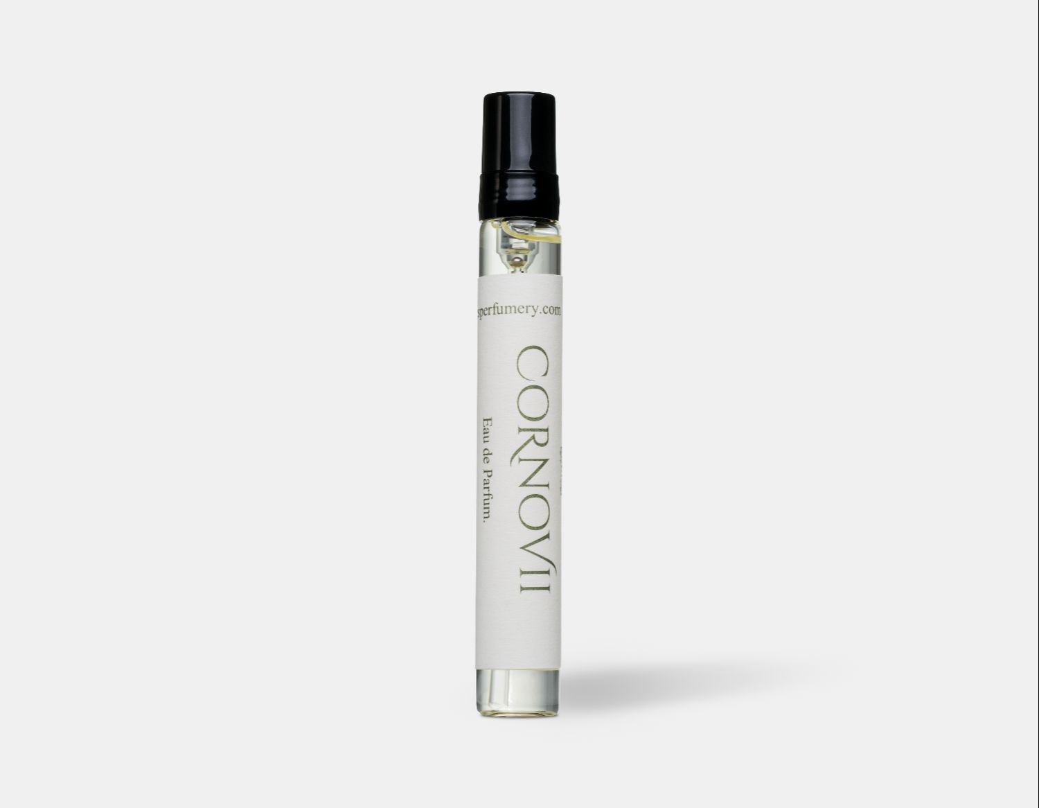 a modern slim perfume bottle with an off white label with green text. The perfume is called Cornovii by Wales Perfumery