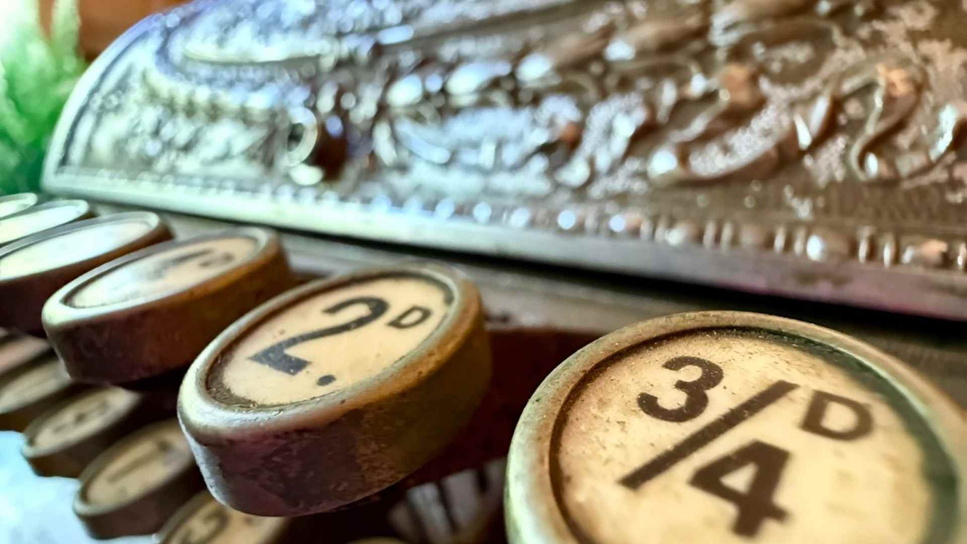 a close up image of an old fashioned shop till