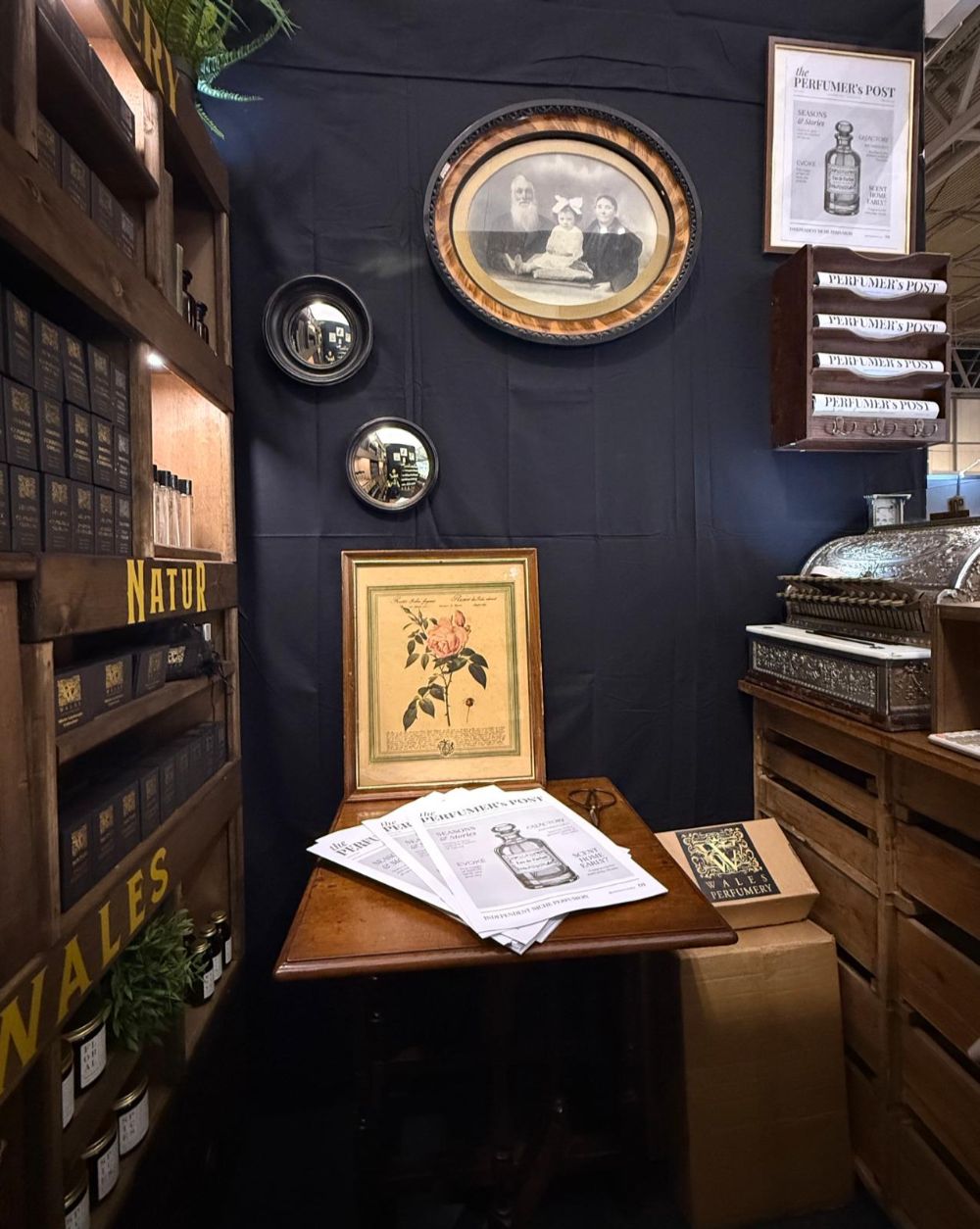 a picture of a vintage perfumery boutique, dark wood and botanical drawings