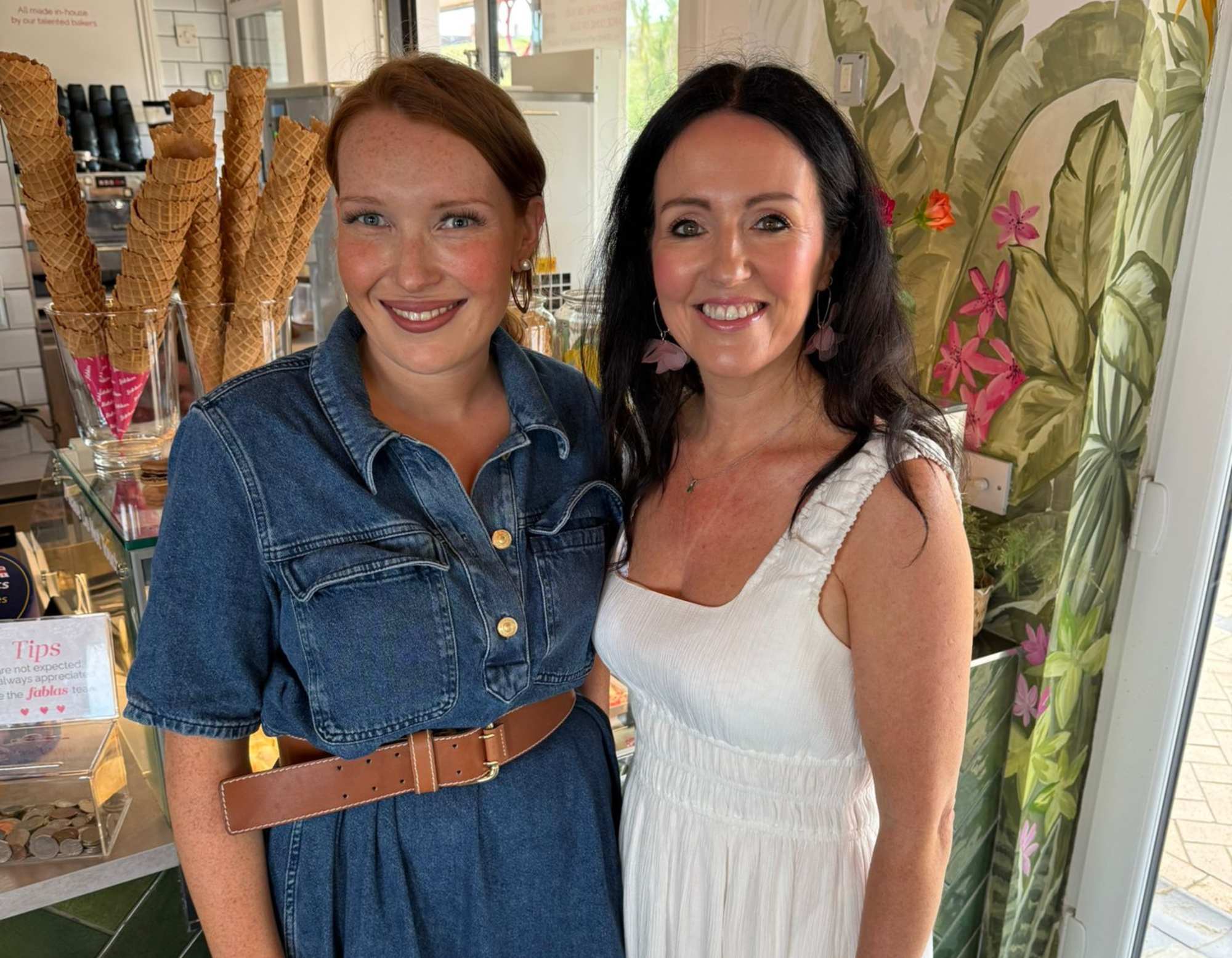 Louise Smith of Wales Perfumery standing with Lauren Evans of Fablas Ice Cream Parlour at the Storii collection launch event, Barry Island