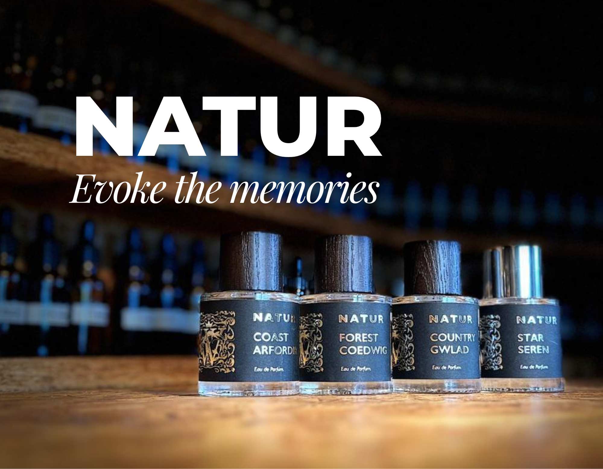 A row of Natur fragrance bottles on a dark wooden surface with the word Natur and the tagline Evoke the memories in white text