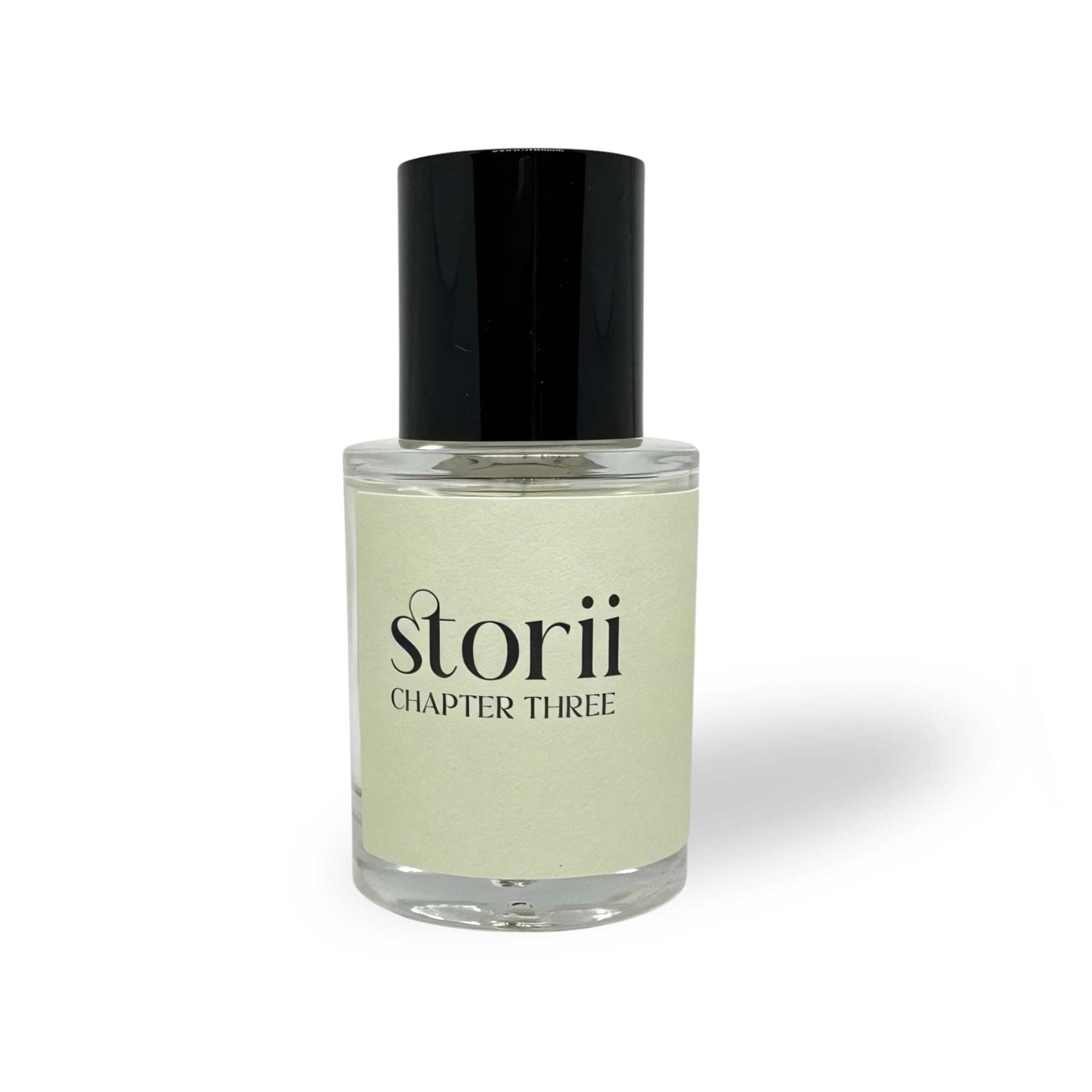 Storii Chapter Three 30ml perfume bottle, sage green label, tall black cap, standing upright on a white background