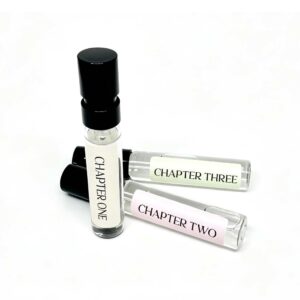 Three Storii perfume sample vials, Chapter One, Chapter Two and Chapter Three, leaning together on a white background