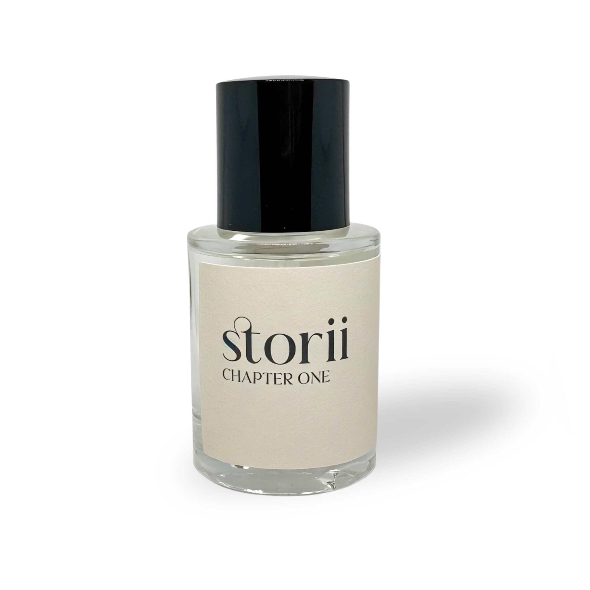 Storii Chapter One 30ml perfume bottle, cream label, tall black cap, standing upright on a white background
