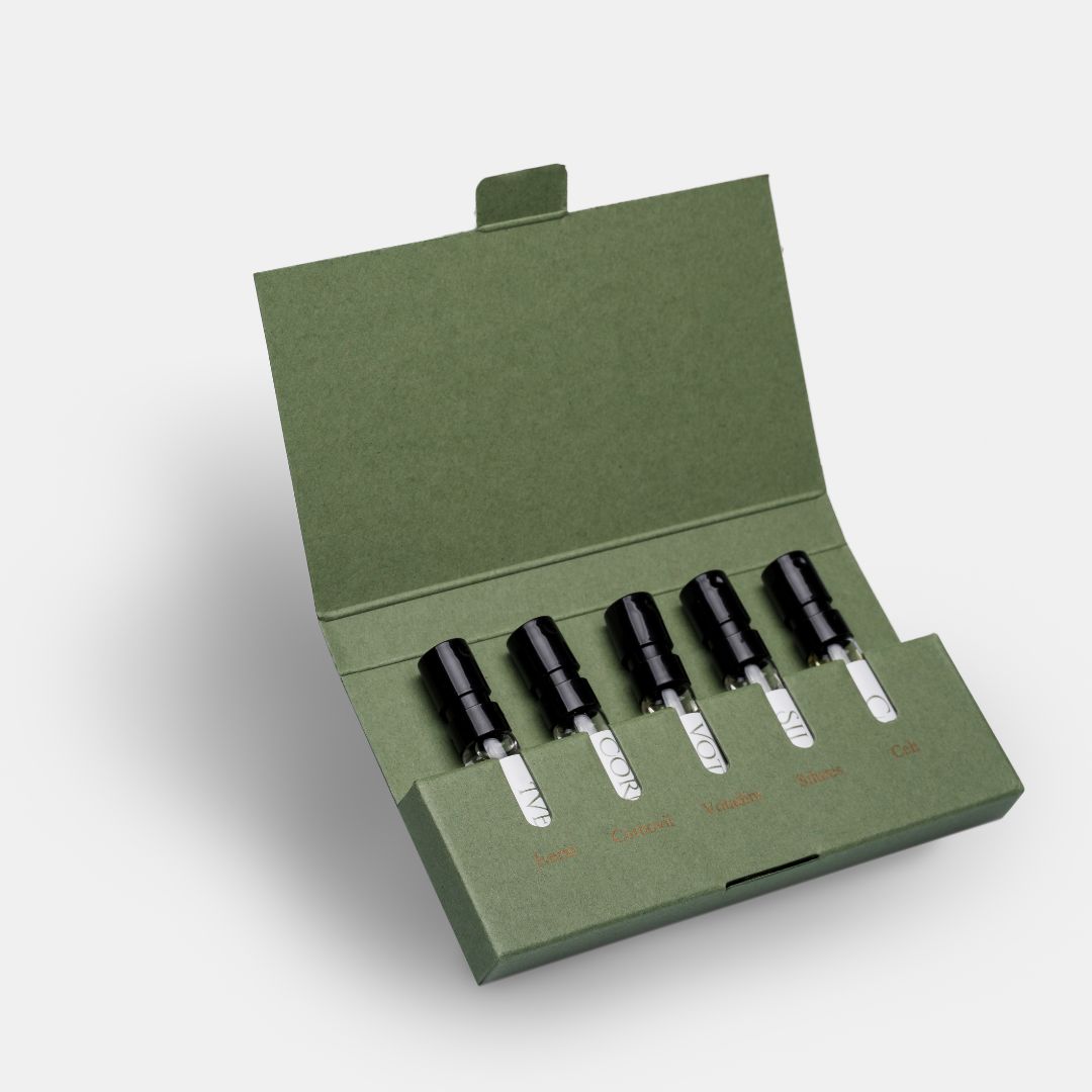 a set of five sample size 2ml perfume bottles in a green presentation box, this is the Celtic perfume discovery set from Wales Perfumery